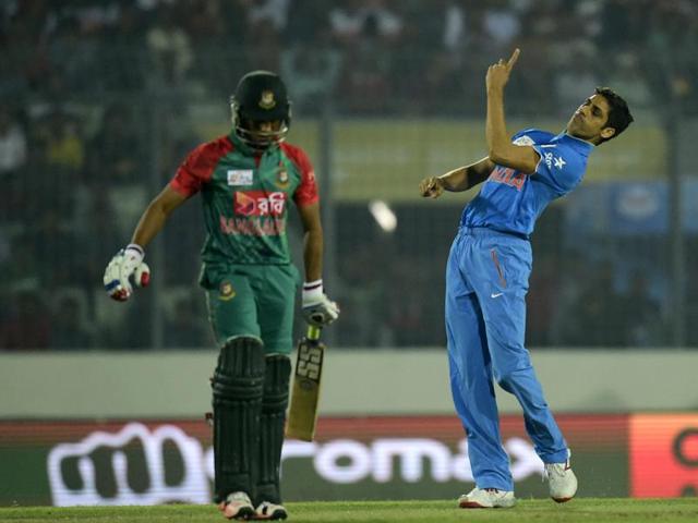 Ashish Nehra (R) celebrates the dismissal of Mohammad Mithun (L). (AFP Photo) Ashish Nehra (R) celebrates the dismissal of Mohammad Mithun (L). (AFP Photo)