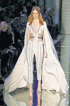 Designer Zuhair Murad also took the belted route with a cape-style fitted jumpsuit with shimmery stripes. A model presents a creation by Zuhair Murad during the 2016 spring/summer Haute Couture collection on January 27, 2016 in Paris. (AFP)