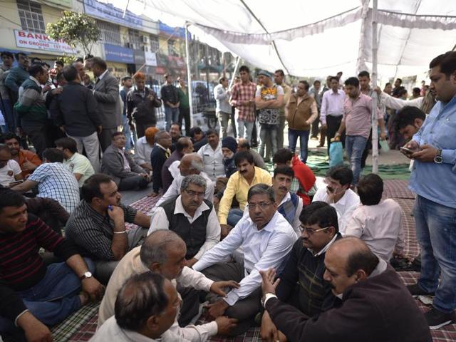 Dang and fellow traders have been on a dharna for the past two days asking the state government to immediately compensate them for losses suffered during the agitation.(Ravi Choudhary/ Hindustan Times)