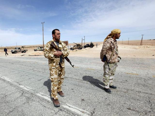 Libyan soldiers manning a military outpost near Tripoli.(REUTERS)