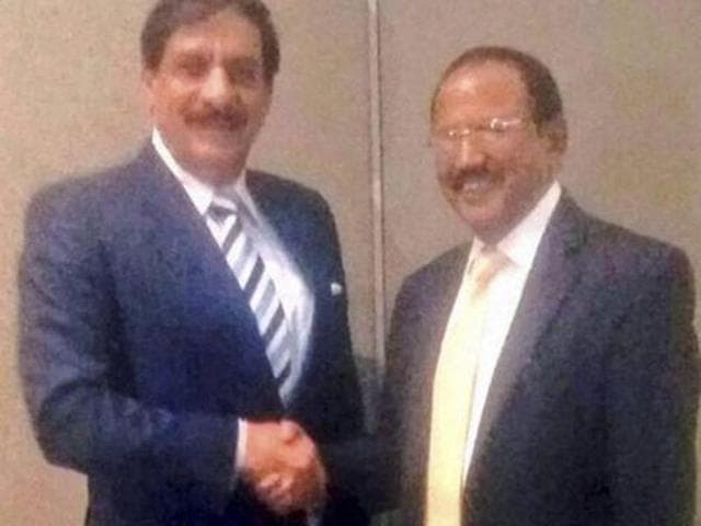 A file photo shows national security advisor Ajit Doval interacts with his Pakistani counterpart Naseer Khan during a delegation-level meeting in Bangkok.(PTI)