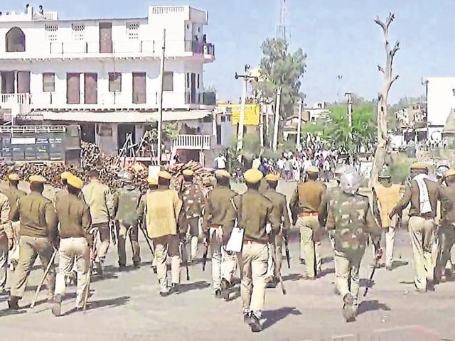 Police personnel try to disperse Jat protesters in Bharatpur on Tuesday afternoon. (HT photo)