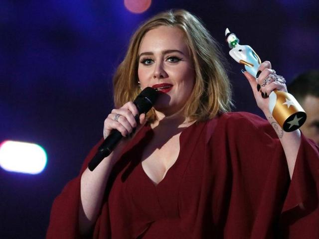 British singer and songwriter Adele accepts the award for best British female solo artist at the BRIT Awards in London, Britain on February 24, 2016.(REUTERS)