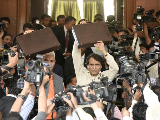 Railway minister Suresh Prabhu arrives at Parliament for presenting the Railway Budget, with MoS Manoj Sinha in New Delhi. (Mohd Zakir/HT Photo) 