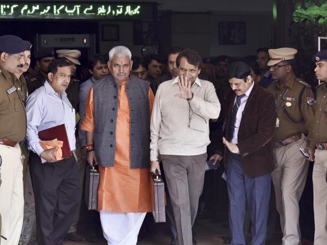 Union minister for railways Suresh Prabhakar Prabhu leaves the Rail Bhawan for Parliament House with the minister of state for railways, Manoj Sinha, to present the Railway Budget 2016-17, in New Delhi.  (Sanjeev Verma/HT Photo) 