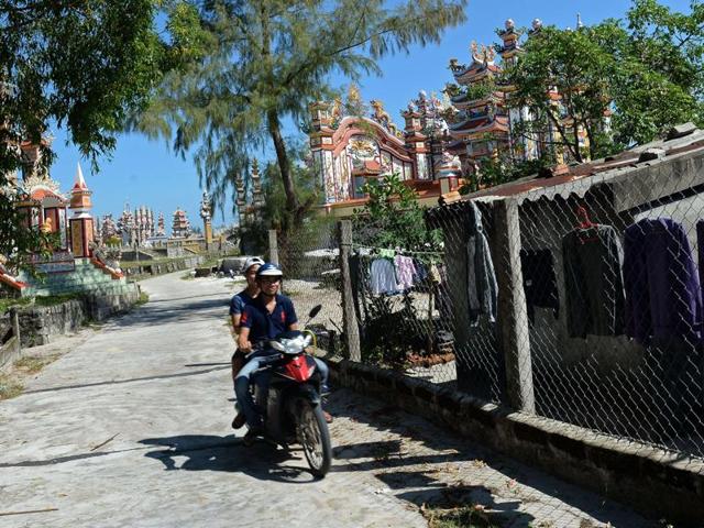 A cluster of cemeteries in the village. Some tombs in the village, set next to white sand beach, rise up to ten metres high, with every inch meticulously decorated. (AFP) 