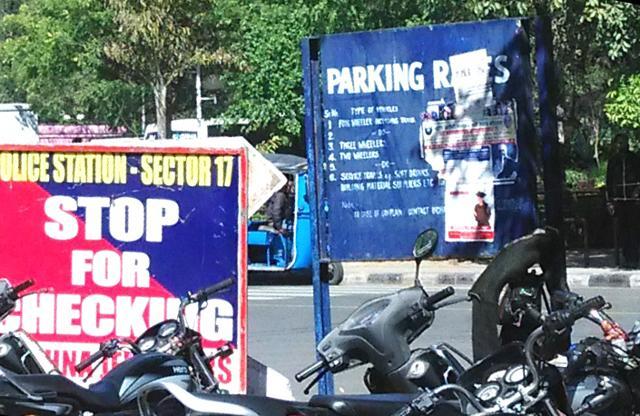 Rate list at the parking lot is concealed under a pamphlet. (HT Photo )