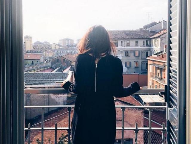 This is a morning from Milan and the woman is taking it all in before heading off to work. (livingboldly.ca) 