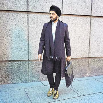 Golden feat: London-based designer Jeetinder Sandhu rocks a pair of golden shoes designed by him. Teamed with dark blue jeans, a classic white shirt and a blue long coat, they add just the right amount of shine to his look.
