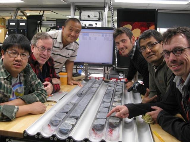 In this handout photo, the team of scientists of the International Ocean Discovery Programme which is drilling the ocean crust to the mantle of the earth, can be seen. An Indian, Biswajit Ghosh (2nd on the right side) is part of the team. (HT Photo / via Biswajit Ghosh)(HT Photo)