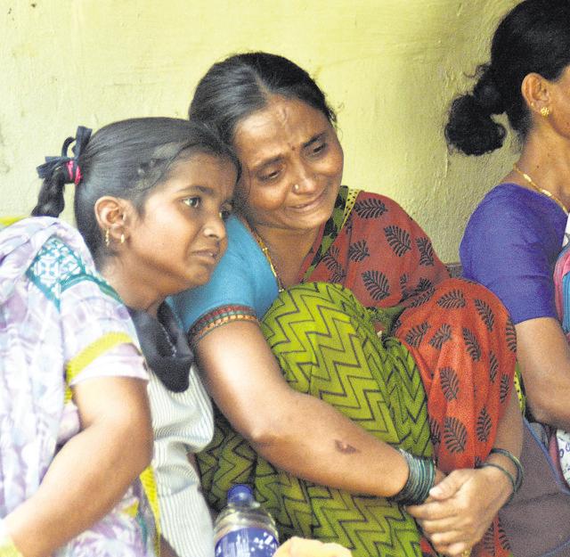Seven-year-old victim Ashok Murgan’s mother and sister after being informed of his death. (Prashant Waydande/)