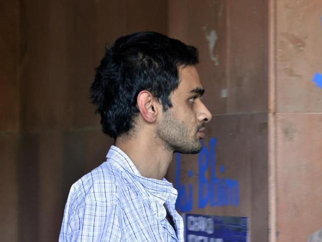 Kanhaiya Kumar (C), head of the student union at Delhi's Jawaharlal Nehru University (JNU), is escorted by police outside the Patiala House court in New Delhi(REUTERS)
