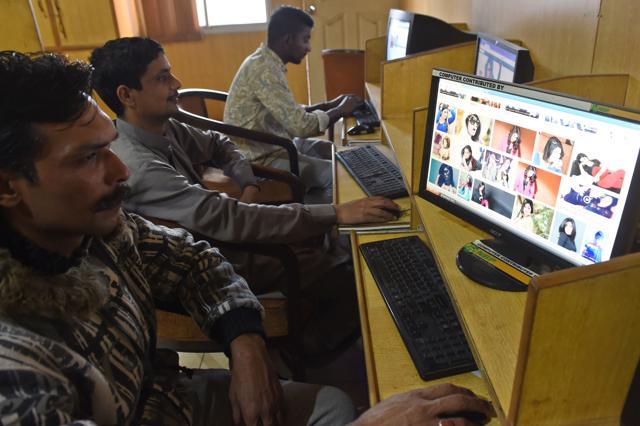 Pakistani internet consumers look at images of Qandeel Baloch. (AFP)