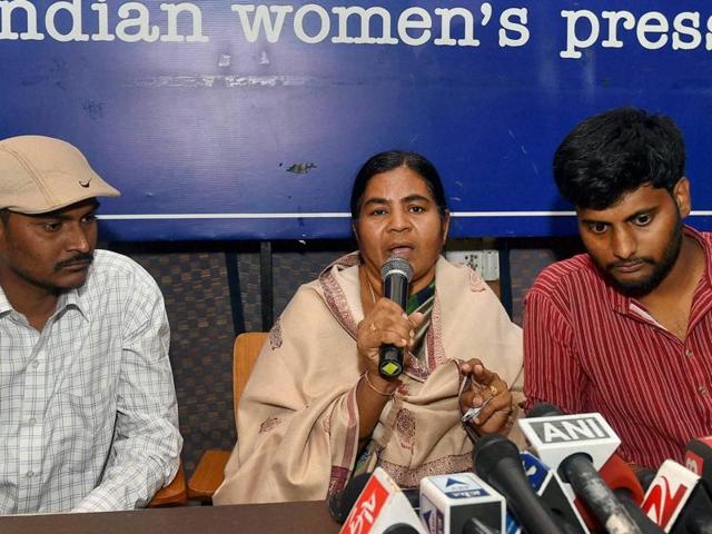 Dalit research scholar Rohith Vemula's mother Radhika and his brother (L) with Prasanth Dontha, a student expelled from Hyderabad University, at a press conference in New Delhi on Friday.(PTI)