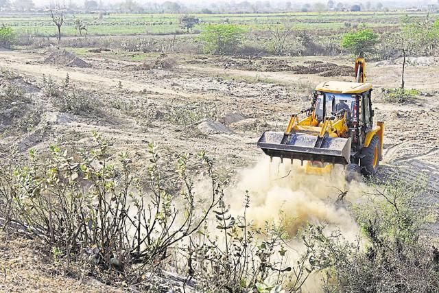 JCB machines can be seen working throughout the day. (Saumya Khandelwal/HT Photo)