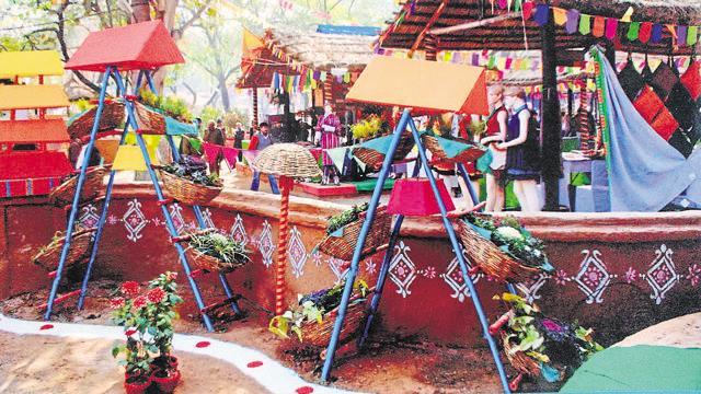 Paint bamboo ­ladders and use them to hang baskets with plants at different levels.