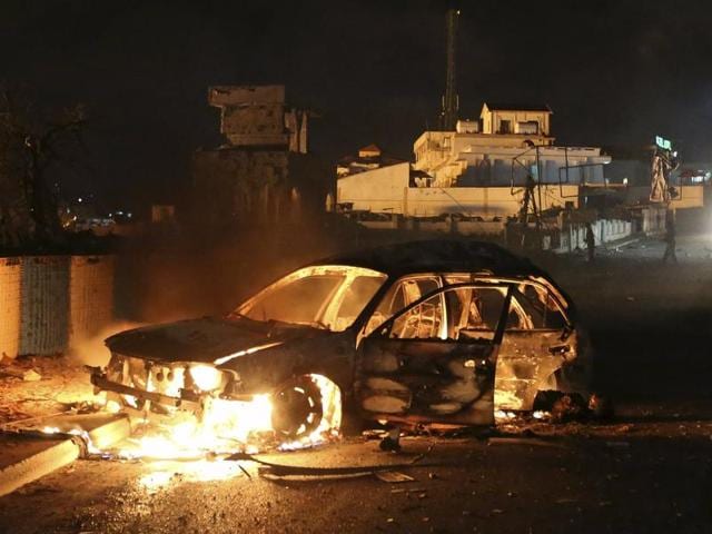 A car suspected by the Somali police to have been used in a bomb attack burns along a street near a hotel in Hamarweyne district in capital Mogadishu. (REUTERS) A car suspected by the Somali police to have been used in a bomb attack burns along a street near a hotel in Hamarweyne district in capital Mogadishu. (REUTERS)