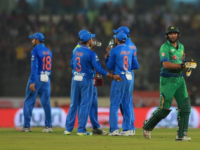 Pakistan captain Shahid Afridi walks off after being run out by Ravindra Jadeja.  (AFP Photo) 