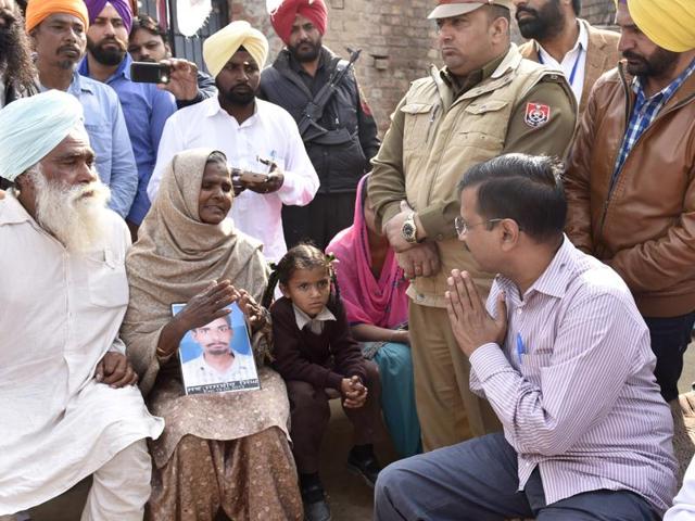Arvind Kejriwal along with AAP leaders interacting with family members of a drug addict at Harike village of Tarn Taran district on Saturday. (Gurpreet Singh/HT)