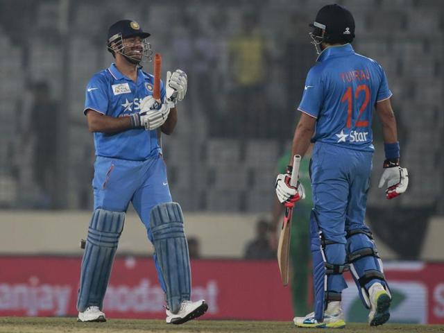 India’s captain Mahendra Dhoni and Yuvraj Singh celebrate after winning the Asia Cup Twenty20 international cricket match against Pakistan. (AP Photo) 