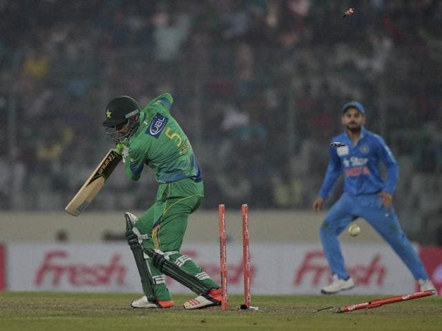 Mohammad Amir, left, is bowled by Hardik Pandya. (AP Photo) 