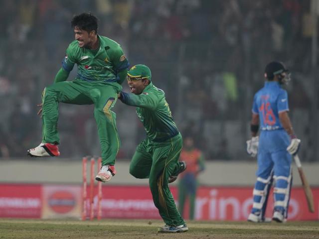 Mohammad Amir, left, after the dismissal of Raina. (AP Photo) 