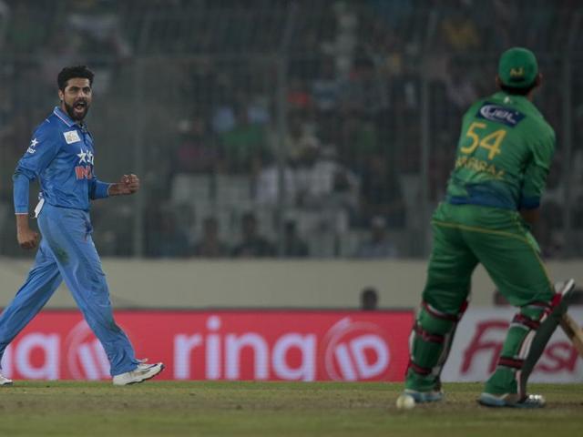 Ravindra Jadeja, left, celebrates the dismissal of Pakistan’s Sarfraz Ahmed. (AP Photo) 