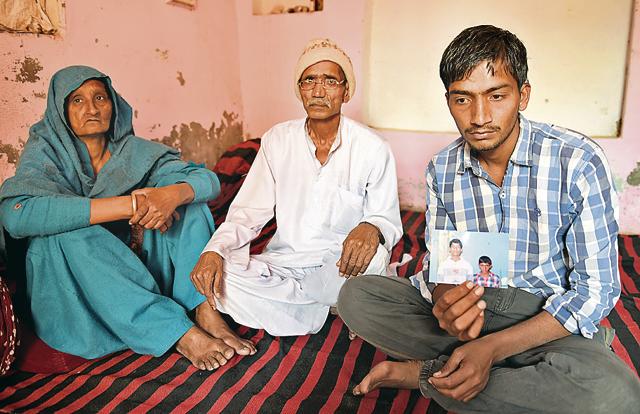 The aged parents of 25-year-old Anil with their youngest son. (Sanjeev Sharma/HT) The aged parents of 25-year-old Anil with their youngest son. (Sanjeev Sharma/HT)