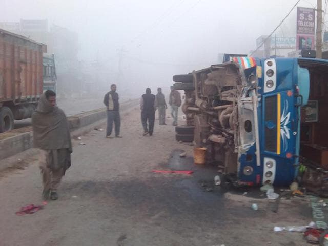 Pligrims travelling back from Chintpurni had a narrow escape as the bus they were travelling in turned turtle at near Amritsar on Sunday.(HT Photo)