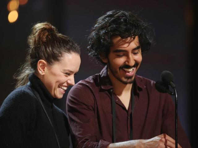 Daisy Ridley, left, and Dev Patel. While the men rehearsing on Saturday wore sneakers or other casual shoes, most of the women tried out the towering high heels they plan to wear during the show. (Matt Sayles/Invision/AP) Daisy Ridley, left, and Dev Patel. While the men rehearsing on Saturday wore sneakers or other casual shoes, most of the women tried out the towering high heels they plan to wear during the show. (Matt Sayles/Invision/AP)