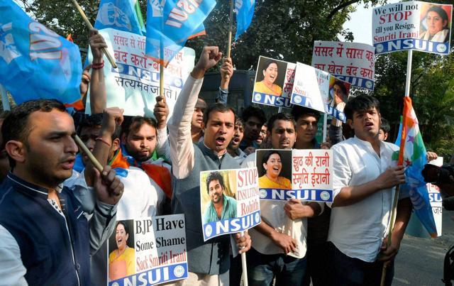 NSUI president Rozi M John, along with other students, shouts slogans during a protest against HRD minister Smriti Irani. (PTI Photo) NSUI president Rozi M John, along with other students, shouts slogans during a protest against HRD minister Smriti Irani. (PTI Photo)