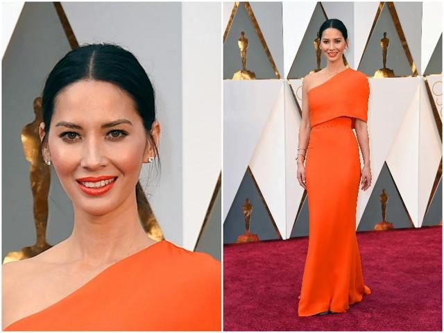 Olivia Munn is shining bright like the sun in this orange dress but whatever has she done to her face? We had to take a second look. (AP)