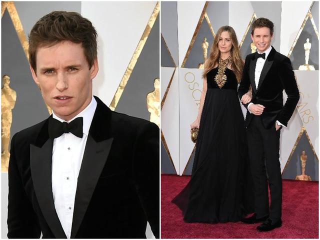 Eddie Redmayne with pregnant wife Hannah. Redmayne says that the velvet suit is making him sweat like anything. (AP)