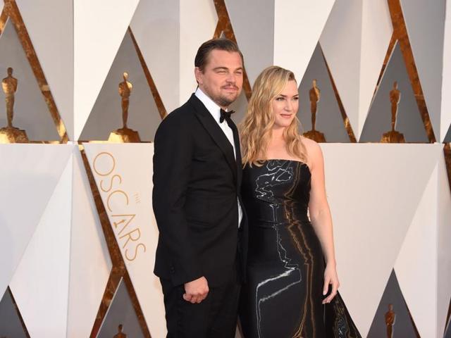 Leonardo DiCaprio and Kate Winslet arrive together. Dunno about Leo but Kate Winslet looks too smitten by spandex. (AP)