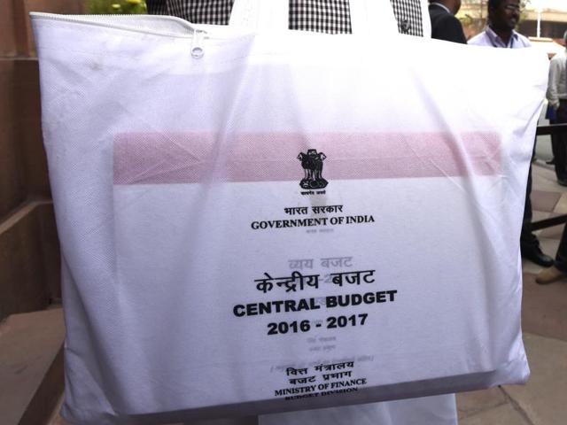 An MP carries a budget copy outside the Parliament building in New Delhi. (Sonu Mehta/HT Photo) An MP carries a budget copy outside the Parliament building in New Delhi. (Sonu Mehta/HT Photo)
