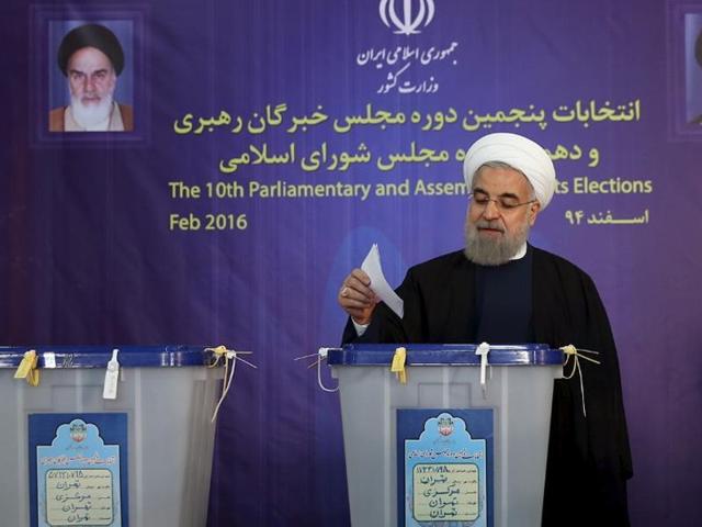 Iranian President Hassan Rouhani casts his vote during elections for the parliament and Assembly of Experts, which has the power to appoint and dismiss the supreme leader, in Tehran.(Reuters Photo)