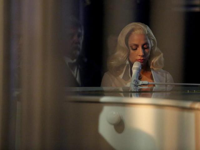 Lady Gaga is seen from backstage as she performs her nominated song Til It Happens To You at the Oscars on Sunday, getting a standing ovation for her performance. (AP) Lady Gaga is seen from backstage as she performs her nominated song Til It Happens To You at the Oscars on Sunday, getting a standing ovation for her performance. (AP)