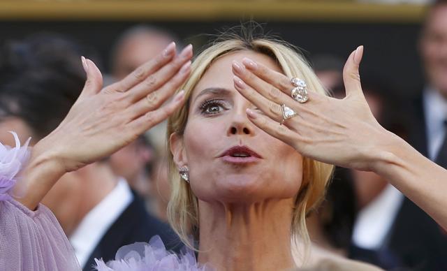 Supermodel Heidi Klum wore a 20 carat white and pink diamond pave triangle studs to accent her lilac-colored gown. She also donned several diamond rings including a pinkish Golconda 20 carat ring, a 12 carat ring, and a 16 carat ring - totaling 67 carats of diamonds and around $2.5 million - the latter of which she showed off on Instagram before hitting the red carpet. (REUTERS)