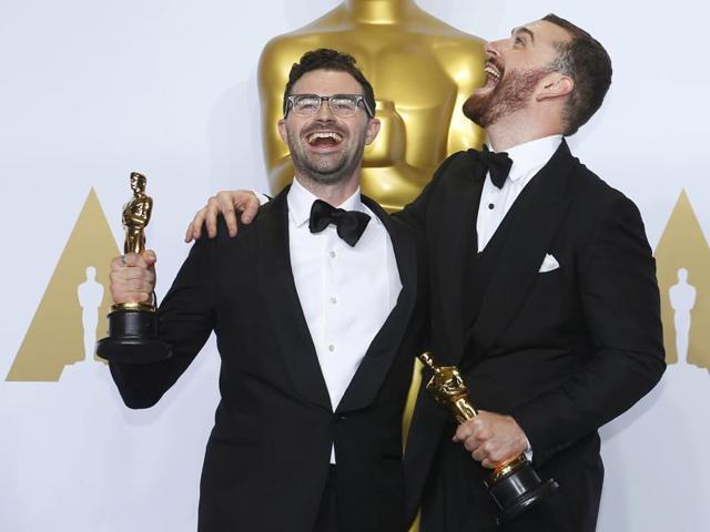 Jimmy Napes and Sam Smith (R), winners for Best Original Song for Writing's on the Wall from Spectre pose with their Oscars backstage during the 88th Academy Awards in Hollywood, California February 28, 2016. (REUTERS) Jimmy Napes and Sam Smith (R), winners for Best Original Song for Writing's on the Wall from Spectre pose with their Oscars backstage during the 88th Academy Awards in Hollywood, California February 28, 2016. (REUTERS)