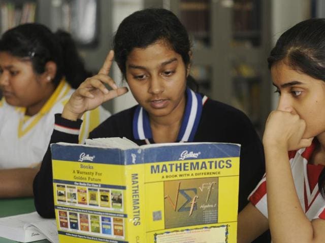 With CBSE exams scheduled to begin from March 1, Class 12 students are engaged in getting their doubts cleared from their teachers and friends at the Study Hall School in Lucknow on Saturday. (Deepak Gupta/ HT photo)