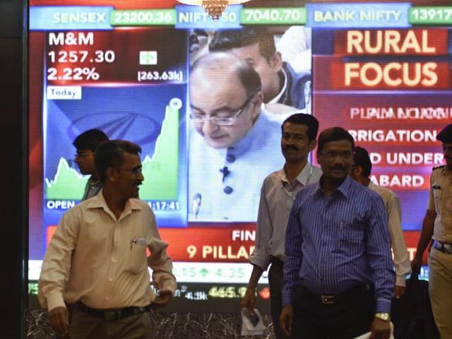 Office-goers walk past a digital screen showing Indian finance minister Arun Jaitley delivering his Budget speech at Parliament in New Delhi, on the facade of the Bombay Stock Exchange (BSE) in Mumbai on Monday. (Kunal Patil/ HT Photo) Office-goers walk past a digital screen showing Indian finance minister Arun Jaitley delivering his Budget speech at Parliament in New Delhi, on the facade of the Bombay Stock Exchange (BSE) in Mumbai on Monday. (Kunal Patil/ HT Photo)