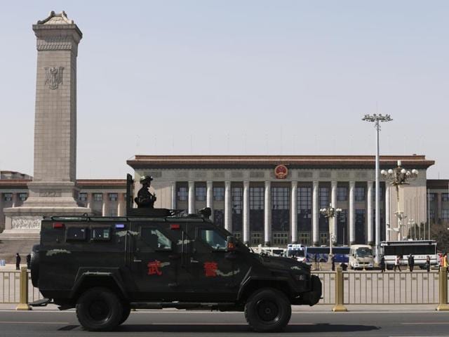 An armed Chinese paramilitary policeman standing atop an armored vehicle patrols past Tiananmen Square and the Great Hall of the People, ahead of a national political conclave in Beijing, Monday. Chinese businessman Ren Zhiqiang, nicknamed “the Cannon”, voices his provocative opinions and blunt defences of economic inequality to his 37 million followers on Sina Weibo. (Andy Wong/AP) An armed Chinese paramilitary policeman standing atop an armored vehicle patrols past Tiananmen Square and the Great Hall of the People, ahead of a national political conclave in Beijing, Monday. Chinese businessman Ren Zhiqiang, nicknamed “the Cannon”, voices his provocative opinions and blunt defences of economic inequality to his 37 million followers on Sina Weibo. (Andy Wong/AP)