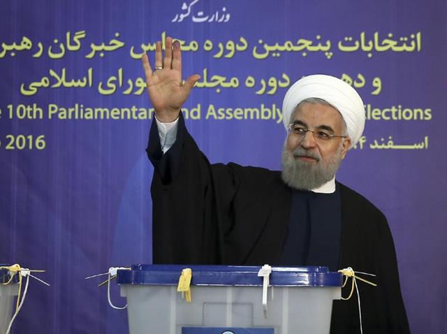 President Hassan Rouhani waves to media after casting his vote for parliamentary and Experts Assembly elections in Tehran, Iran. (Iranian Presidency Office via AP File Photo) President Hassan Rouhani waves to media after casting his vote for parliamentary and Experts Assembly elections in Tehran, Iran. (Iranian Presidency Office via AP File Photo)