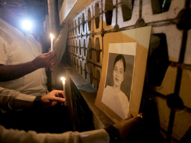 A file photo of demonstrators holding a candlelight vigil for Ishrat Jahan, the 19-year-old Mumbra student, was shot dead in Gujarat in 2004. A file photo of demonstrators holding a candlelight vigil for Ishrat Jahan, the 19-year-old Mumbra student, was shot dead in Gujarat in 2004.
