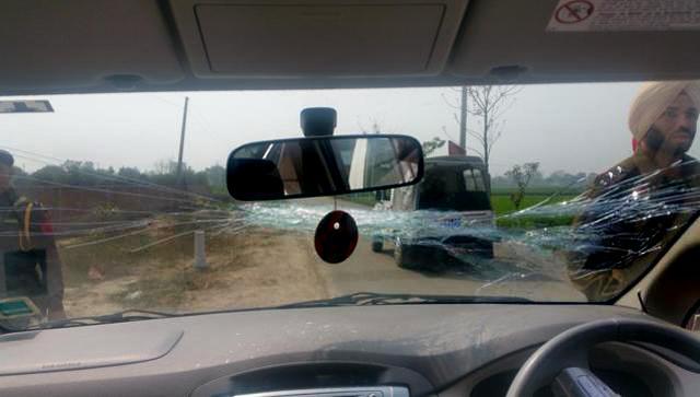 Broken windshield of the car that was attacked when AAP convener and Delhi CM Arvind Kejriwal was in the front seat, at Hasanpur village in Ludhiana on Monday. (HT Photo)