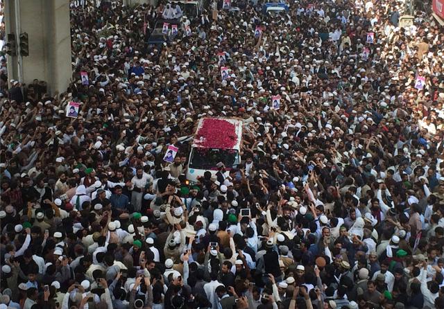 Thousands of people move with an ambulance carrying the body of police officer Mumtaz Qadri, the convicted killer of former governor Salmaan Taseer, during funeral prayers in Rawalpindi on Tuesday. (AP Photo) Thousands of people move with an ambulance carrying the body of police officer Mumtaz Qadri, the convicted killer of former governor Salmaan Taseer, during funeral prayers in Rawalpindi on Tuesday. (AP Photo)