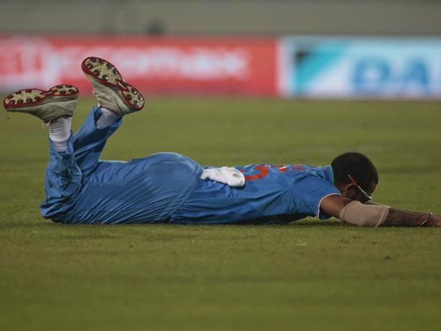 India’s Shikhar Dhawan dives to stop the ball. (AP Photo) 