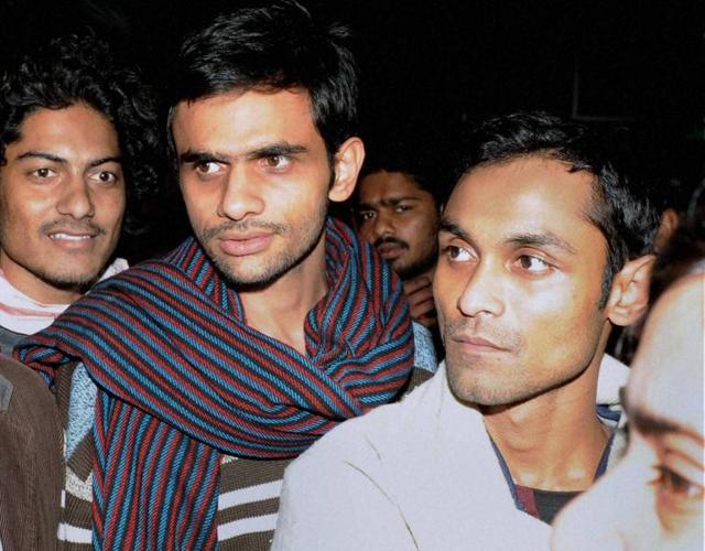 Jawaharlal Nehru University students Umar Khalid (C) and Anirban Bhattacharya (R) were sent to 14 day judicial custody on Tuesday.(PTI File Photo)