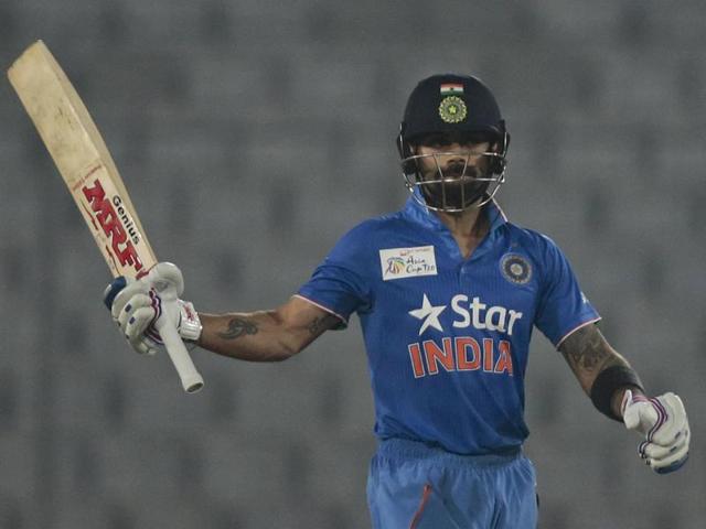 India’s Virat Kohli acknowledges the crowd after scoring fifty runs during the Asia Cup Twenty20 international cricket match against Sri Lanka. (AP Photo) 