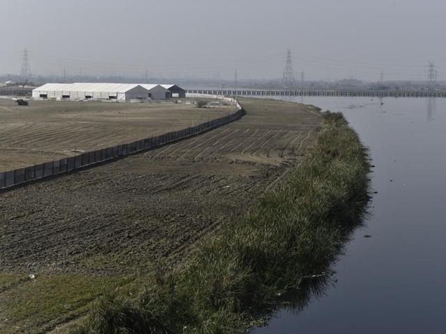A structure under construction for which the bank has been levelled. The three-day Art of Living event is scheduled for March 11-13. Construction is underway with tents, hutments, barricades and indiscriminate use of malba in over 1,000 acres of the Yamuna floodplains in East Delhi. (Saumya Khandelwal/HT Photo) A structure under construction for which the bank has been levelled. The three-day Art of Living event is scheduled for March 11-13. Construction is underway with tents, hutments, barricades and indiscriminate use of malba in over 1,000 acres of the Yamuna floodplains in East Delhi. (Saumya Khandelwal/HT Photo)